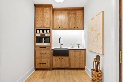 White oak cabinets, sink, dishwasher, and Wolf built-in coffee maker