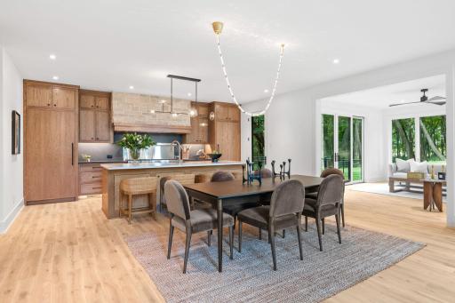 Step over to the Chef's kitchen with spacious center island, Cambria countertops, and solid White Oak cabinets