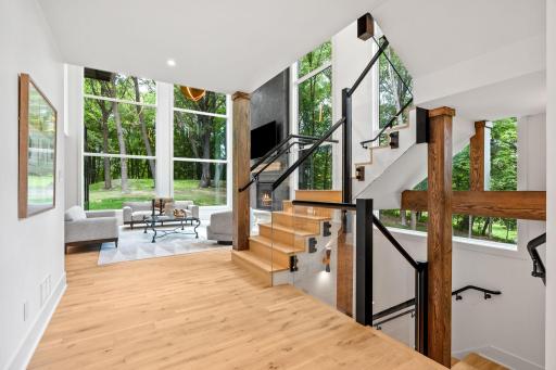 Walk in to stunning white oak flooring throughout the main level