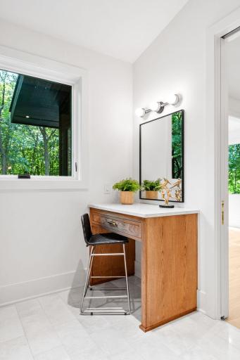 Separate vanity and private wooded views