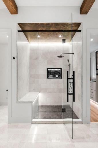 Tiled walk in-shower with under lighting