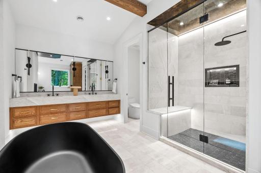 Tiled walk in-shower with under lighting