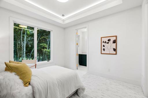 Fourth bedroom on the upper level with en-suite bathroom and walk-in closet