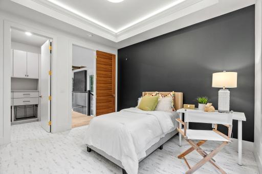 Fourth bedroom on the upper level with en-suite bathroom and walk-in closet