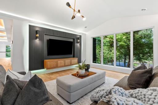 Upper level family room with walls of windows around