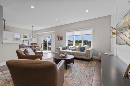 Main level living offers an expansive Rambler floor plan with large windows, striking upgrades and design details throughout.