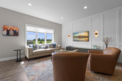 Striking board-and-batten wood accent wall, creating warmth and character throughout. Fabulous open-concept!