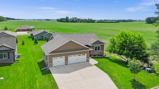 Stand out curb appeal with upgrade concrete drivway, walkway and large front porch. Sweeping field views offers a serene setting on a dead-end street.