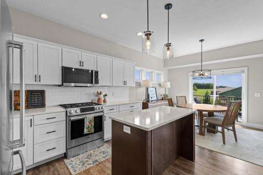 Center island with breakfast bar space. Standout design and details throughout!