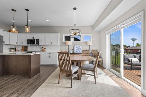 Spacious informal dining with walkout to private deck retreat.