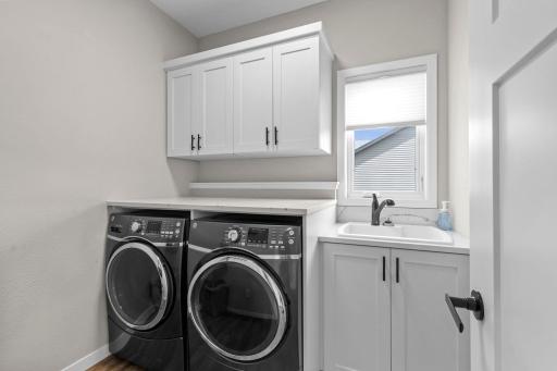Main level laundry with custom built-ins.
