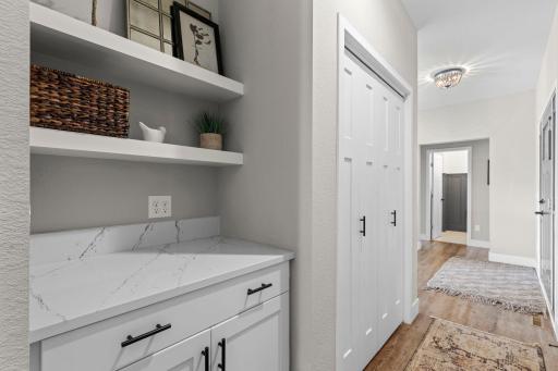 Custom built-ins and floating shelves throughout.