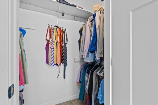 Primary offers double walk-in closet spaces.