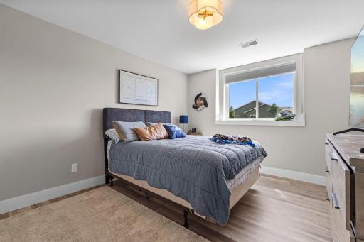 Two spacious lower level bedrooms with large, lookout windows.