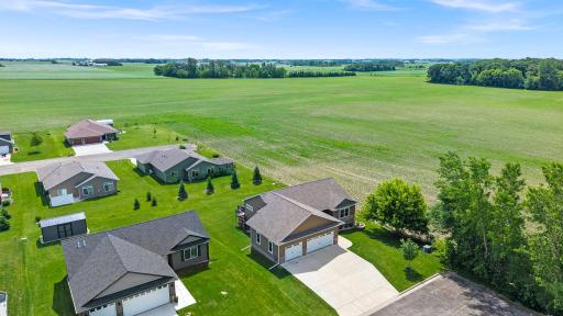 Absolutely stunning, better than new Rambler nestled on a quiet dead-end street, this home enjoys peaceful views overlooking open fields, offering a serene setting and a welcome sense of privacy. Awesome Owatonna location!