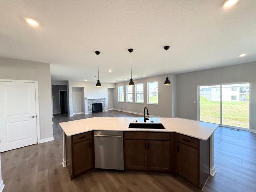 Photo From Actual Home: The large island looks over the informal dining and living room.