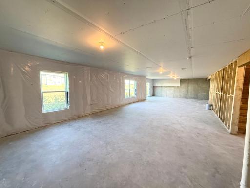 This basement is huge, ready for a future family room, bedroom, and bathroom.