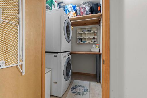 Laundry room featuring built-in shelving for added storage and organization.