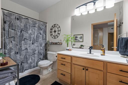 Upper-level full bathroom with a practical layout and clean, modern finishes.