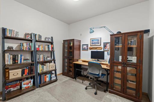 Upstairs den offering flexible use as a guest room, office, or hobby space.