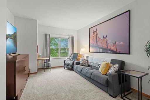 The primary bedroom features front-facing views and a spacious walk-in closet.