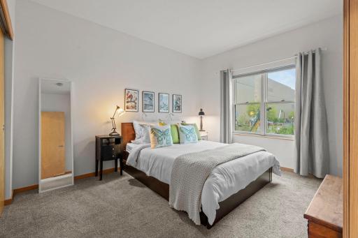 Second bedroom with front-facing windows and natural light.