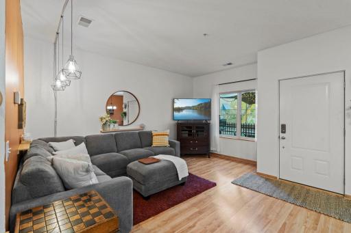 Large picture window filling the living room with natural light.