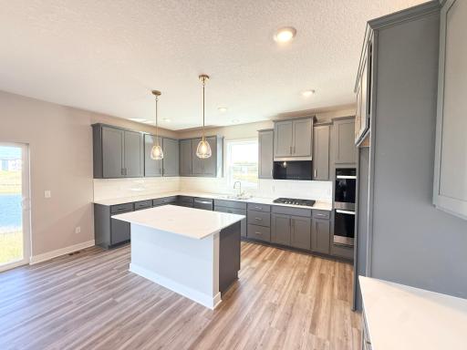 Photo from Actual Home: This gorgeous kitchen has a large island adding tons of counter space.