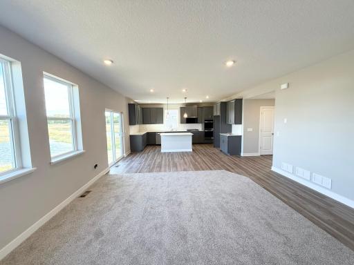 Photo from Actual Home: This home is easy living, with seamless flow from kitchen to dining to living.