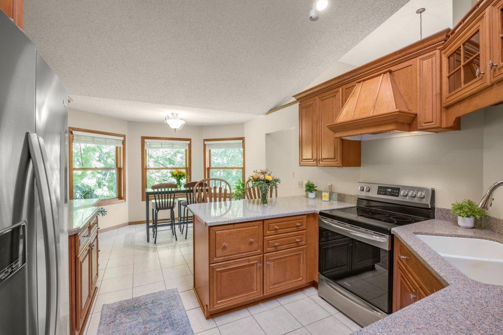 First the Kitchen, Center Island and informal dining area.