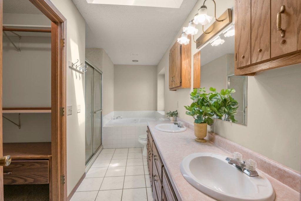 Primary Bathroom with heat floors and Jet Soaking Tub.