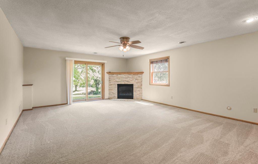 Big Lower Level Walkout Family Room with Fireplace. how would you like to design this space?