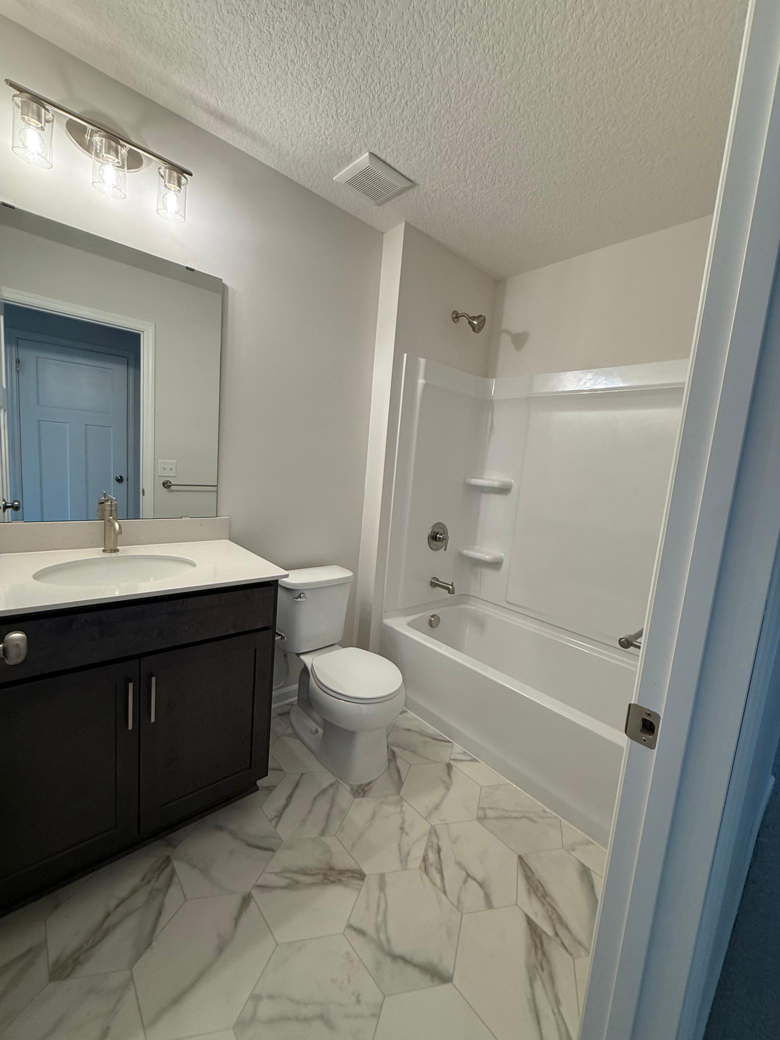 Also, on the top floor we have a shower/tub combo which is set up great for secondary use and for when the fur babies need a bath!