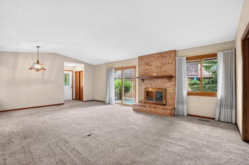 Spacious Living room with wood burning fireplace
