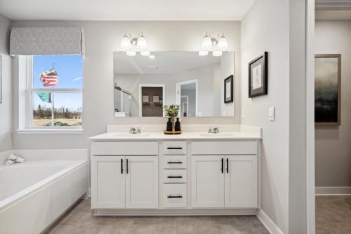 Primary Bathroom offers Quartz, 2 sinks and tons of storage.