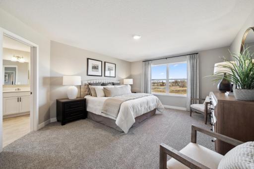 Primary bedroom space is spacious and cozy.