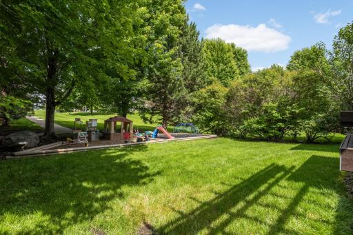 Backyard with play area that could easily be turned into a garden