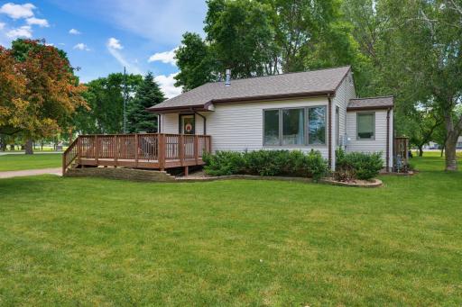 Enjoy your morning coffee or summer evenings on the spacious 15'x11' front wood deck, perfect for outdoor relaxation.