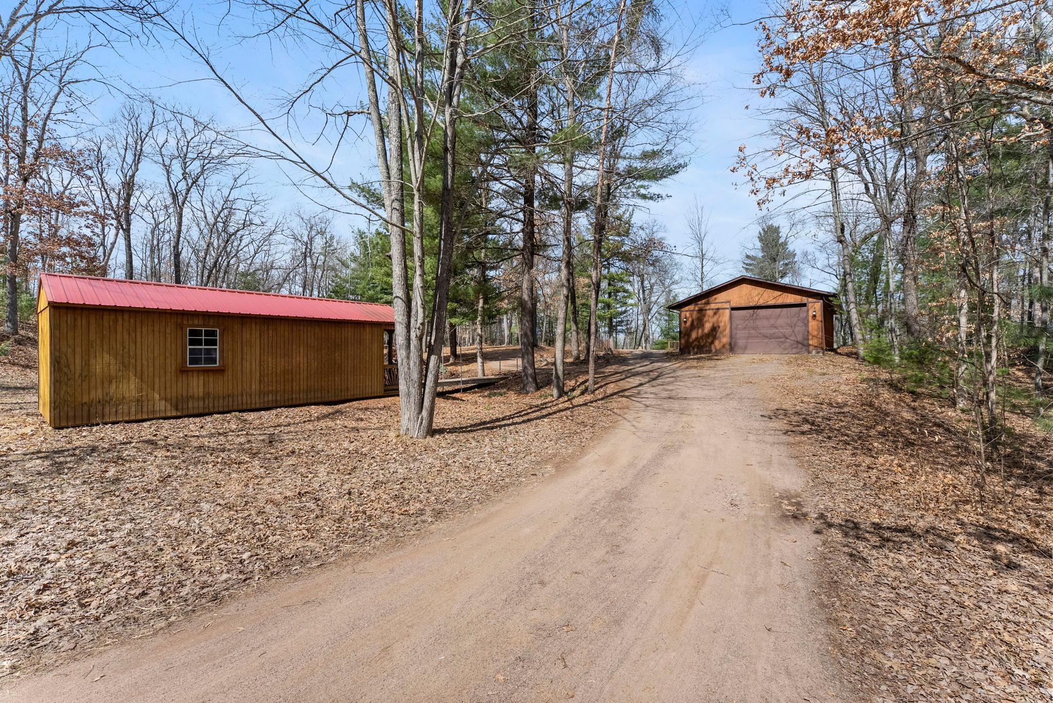 Long private drive past the future bunkhouse to the 26x40 garage.