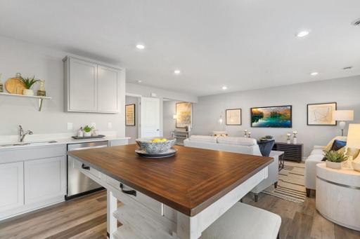 Open concept living with many ways to arrange furniture. Photo is of model home. Colors and options may vary. Ask Sales Agent for details.