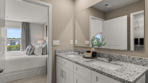 Primary suite. Actual home will include quite quartz countertops. All photos used are of a previous model home.