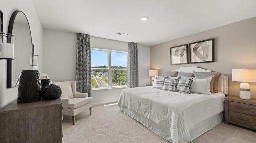 Spacious primary bedroom! All photos used are from a previous model.