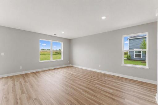 Spacious living room for entertaining and relaxing with friends and family. Photo of spec home, colors and finishes vary.