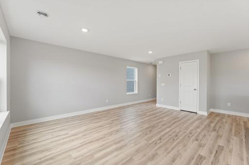 The main level of this home features luxury vinyl plank flooring throughout. Photo of spec home, colors and finishes vary.