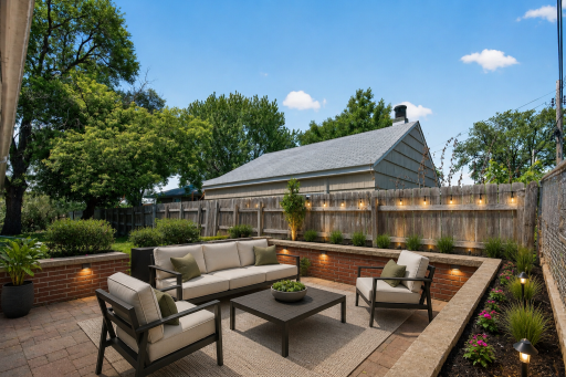 Large patio in your backyard! Great entertaining space! (Photo virtually staged)
