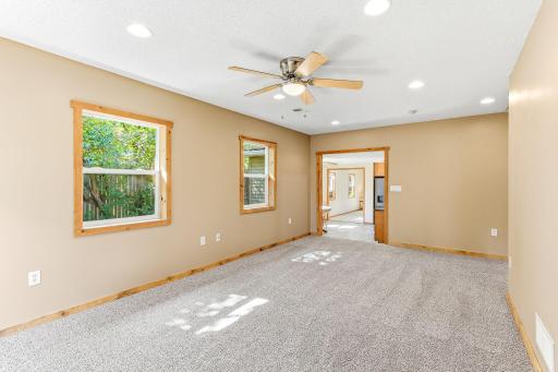 Additional view of the family room showcasing generous living space and easy flow to the main living areas.