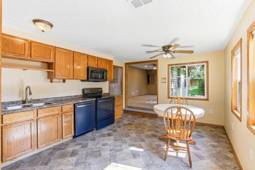 Inviting eat-in kitchen offering generous cabinetry, updated appliances, and abundant natural light.