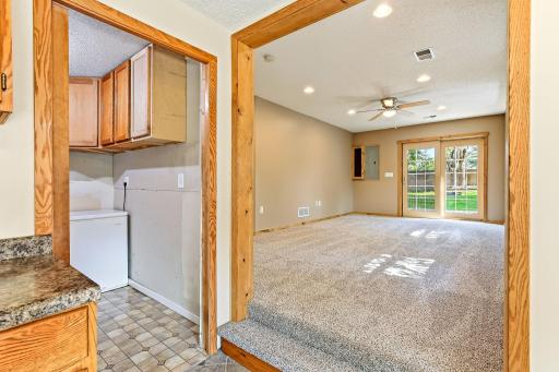 View into the expansive family room featuring abundant natural light, recessed lighting, and walkout access to the backyard.