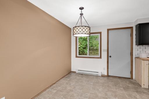 Accent wall sets off this dining area that looks out over the backyard green space.