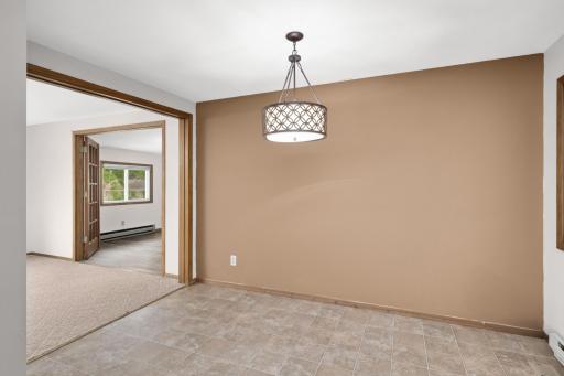Dining flows easily to the living room with fresh paint as well to brighten up the spaces.